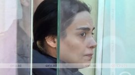 Ərini güllələyərək həyətdə basdırmaqda təqsirləndirilən qadın: "Səhərə qədər yer qazmışam"