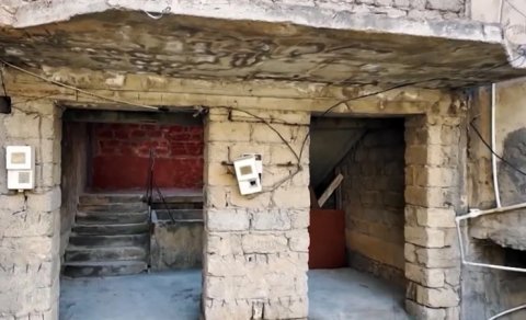 Bakıda yarımçıq tikilidə yeddi ailənin təhlükəli həyatı - VİDEO