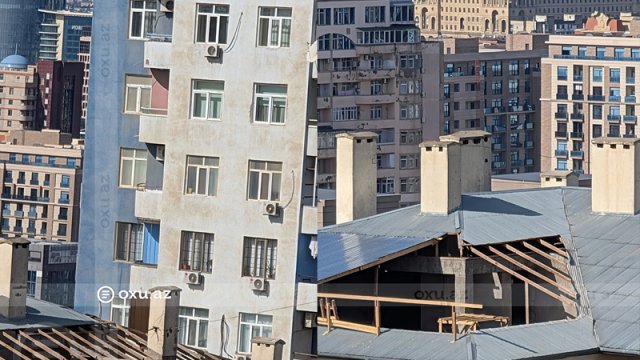 "Kəpəz" MTK binanın damını söküb mərtəbə artırır" - Yasamaldan şikayət